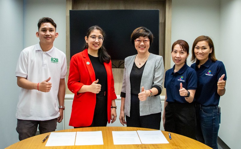 B2B Cambodia and WeWatch teams pose for photo after signing MoU.